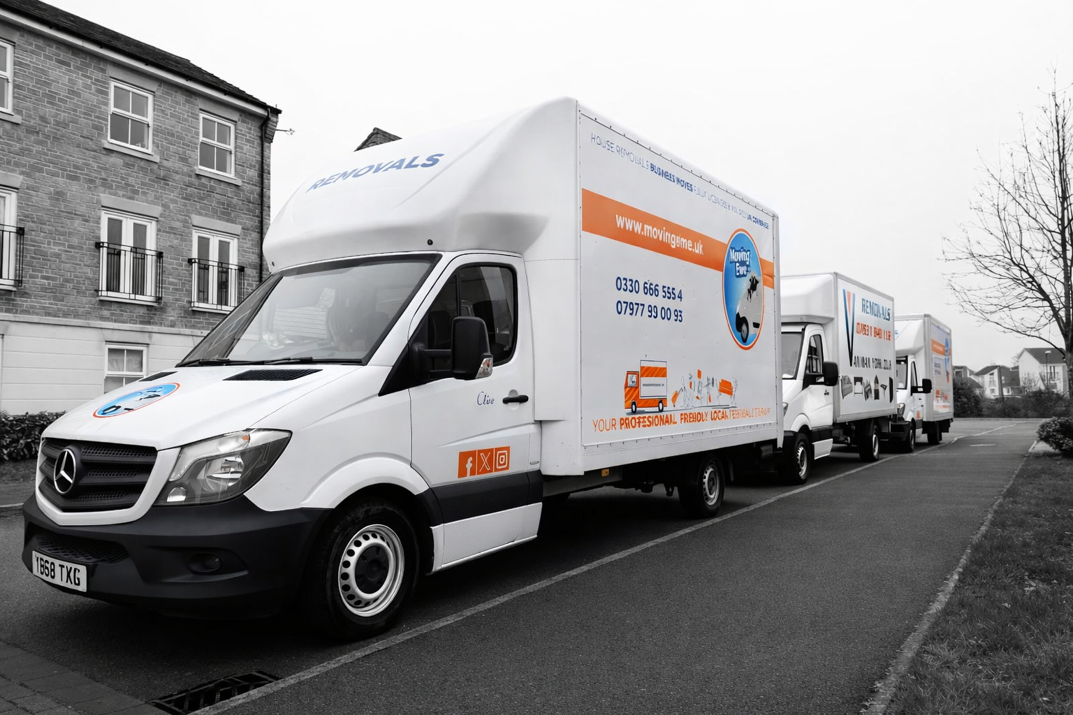 Ravenhill Removals house removal vans parked on a residential street in the UK ready for a home move