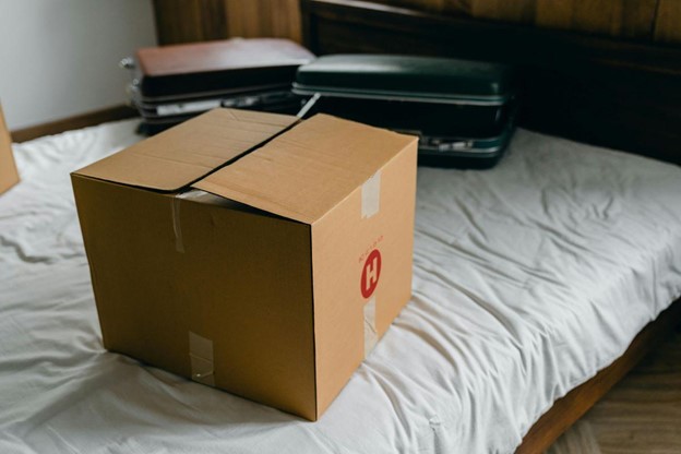 Your financial and emotional exit strategy before you move abroad can shape your entire experience A box on a bed