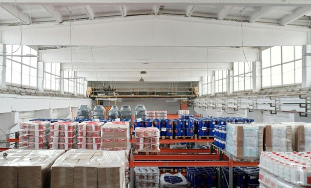 A huge storage room full of boxes and bottles